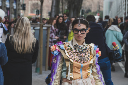 MILAN, ITALY - FEBRUARY 28: People gather outside Jil Sander fashion show building for Milan Women's Fashion Week on FEBRUARY 28, 2015  in Milan.のeditorial素材