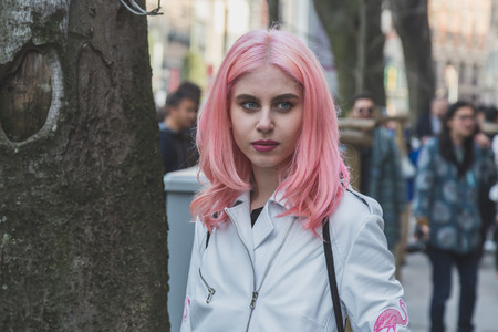 MILAN, ITALY - FEBRUARY 28: People gather outside Jil Sander fashion show building for Milan Women's Fashion Week on FEBRUARY 28, 2015  in Milan.のeditorial素材