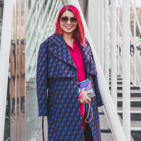 MILAN, ITALY - FEBRUARY 28: People gather outside Jil Sander fashion show building for Milan Women's Fashion Week on FEBRUARY 28, 2015  in Milan.のeditorial素材