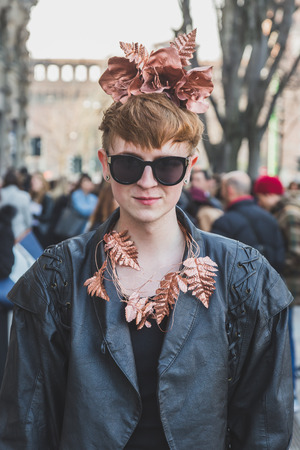 MILAN, ITALY - FEBRUARY 28: People gather outside Jil Sander fashion show building for Milan Women's Fashion Week on FEBRUARY 28, 2015  in Milan.のeditorial素材
