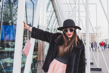 MILAN, ITALY - FEBRUARY 28: People gather outside Jil Sander fashion show building for Milan Women's Fashion Week on FEBRUARY 28, 2015  in Milan.のeditorial素材