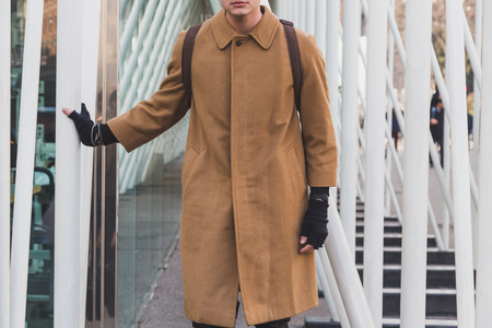 MILAN, ITALY - FEBRUARY 28: Man poses outside Jil Sander fashion show building for Milan Women's Fashion Week on FEBRUARY 28, 2015  in Milan.のeditorial素材