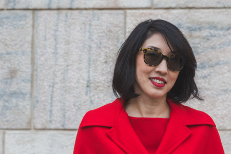 MILAN, ITALY - FEBRUARY 28: People gather outside Gabriele Colangelo fashion show building for Milan Women's Fashion Week on FEBRUARY 28, 2015  in Milan.のeditorial素材