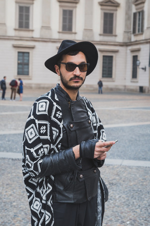 MILAN, ITALY - FEBRUARY 28: Man poses outside Gabriele Colangelo fashion show building for Milan Women's Fashion Week on FEBRUARY 28, 2015  in Milan.のeditorial素材