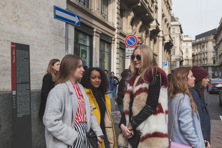 MILAN, ITALY - MARCH 1: People gather outside Ferragamo fashion show building for Milan Women's Fashion Week on MARCH 1, 2015  in Milan.のeditorial素材