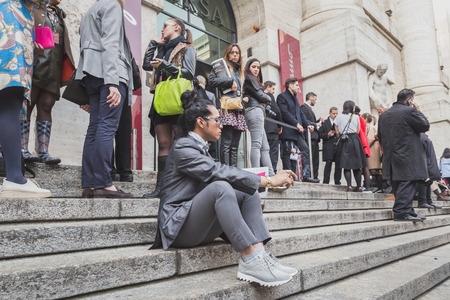 MILAN, ITALY - MARCH 1: People gather outside Ferragamo fashion show building for Milan Women's Fashion Week on MARCH 1, 2015  in Milan.のeditorial素材