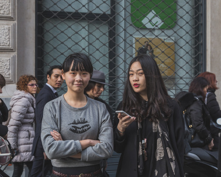 MILAN, ITALY - MARCH 1: People gather outside Ferragamo fashion show building for Milan Women's Fashion Week on MARCH 1, 2015  in Milan.のeditorial素材