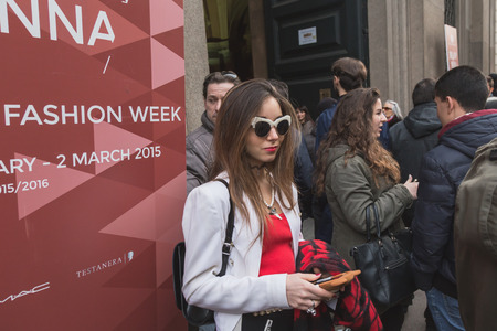 MILAN, ITALY - MARCH 1: People gather outside Trussardi fashion show building for Milan Women's Fashion Week on MARCH 1, 2015  in Milan.のeditorial素材