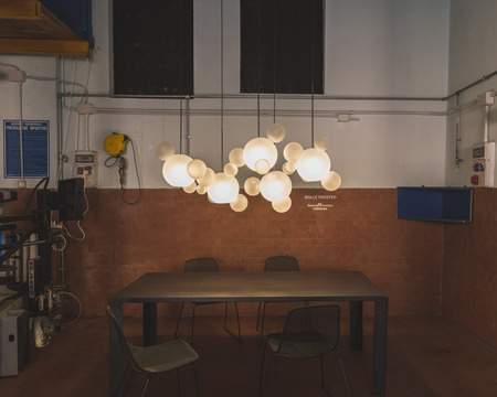 MILAN, ITALY - APRIL 15: Lamps and table on display for Fuorisalone at Ventura Lambrate space, location of important events during Milan Design Week on APRIL 15, 2015 in Milan.のeditorial素材