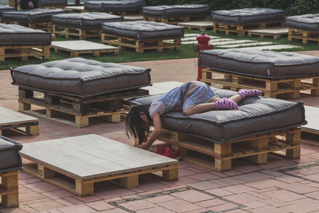 MILAN, ITALY - MAY 4: Little girl resting at Expo, universal exposition on the theme of food on MAY 4, 2015 in Milan.のeditorial素材