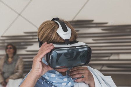 MILAN, ITALY - MAY 4: People trying 3D headset at Expo, universal exposition on the theme of food on MAY 4, 2015 in Milan.のeditorial素材