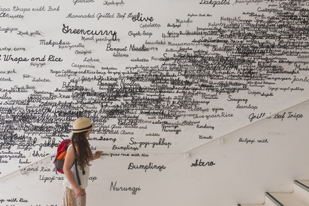 MILAN, ITALY - MAY 13: Girl visits Korea pavilion at Expo, universal exposition on the theme of food on MAY 13, 2015 in Milan.のeditorial素材