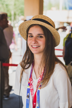 MILAN, ITALY - JUNE 3: Girl working for Swiss pavilion at Expo, universal exposition on the theme of food on JUNE 3, 2015 in Milan.のeditorial素材