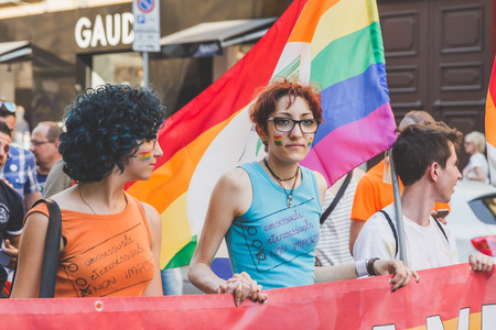 MILAN, ITALY - JUNE 27: People at gay pride parade in Milan JUNE 27, 2015. Thousands of people march in the city streets for the annual gay pride parade, claiming equality and legal rights.のeditorial素材