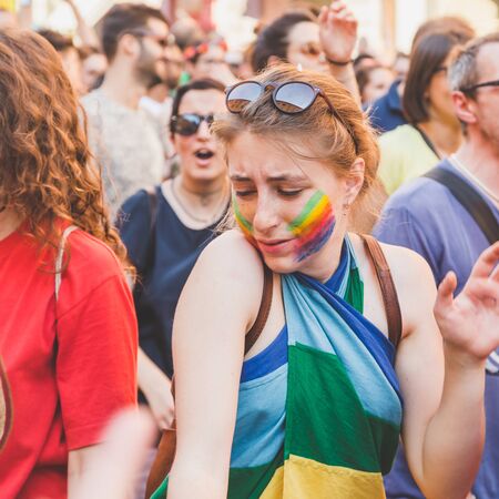 MILAN, ITALY - JUNE 27: People at gay pride parade in Milan JUNE 27, 2015. Thousands of people march in the city streets for the annual gay pride parade, claiming equality and legal rights.のeditorial素材