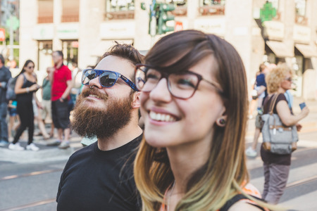MILAN, ITALY - JUNE 27: People at gay pride parade in Milan JUNE 27, 2015. Thousands of people march in the city streets for the annual gay pride parade, claiming equality and legal rights.のeditorial素材