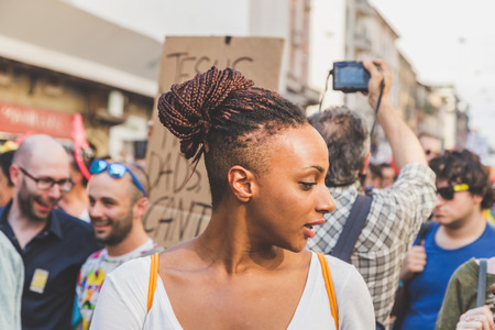 MILAN, ITALY - JUNE 27: People at gay pride parade in Milan JUNE 27, 2015. Thousands of people march in the city streets for the annual gay pride parade, claiming equality and legal rights.のeditorial素材