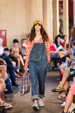 MILAN, ITALY - JUNE 30: Models walk the runway in the Switzerland pavilion at Expo, universal exposition on the theme of food on JUNE 30, 2015 in Milan.のeditorial素材