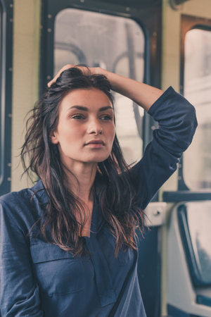 Gorgeous young brunette posing in a metro carの写真素材