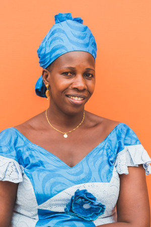 MILAN, ITALY - JULY 22: African woman in her traditional clothing poses at Expo, universal...