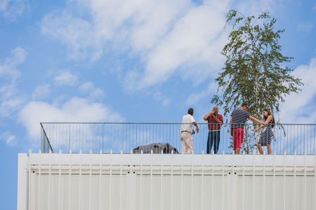 MILAN, ITALY - JULY 29: People on the terrace of Czech Republic pavilion at Expo, universal exposition on the theme of food on JULY 29, 2015 in Milan.のeditorial素材