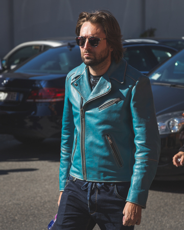 MILAN, ITALY - SEPTEMBER 24: People gather outside Pucci fashion show building for Milan Women's Fashion Week on SEPTEMBER 24, 2015  in Milan.のeditorial素材