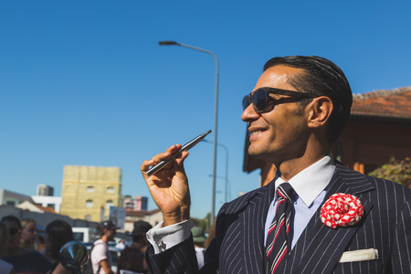 MILAN, ITALY - SEPTEMBER 24: People gather outside Pucci fashion show building for Milan Women's Fashion Week on SEPTEMBER 24, 2015  in Milan.のeditorial素材