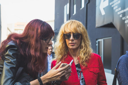MILAN, ITALY - SEPTEMBER 25: People gather outside Iceberg fashion show building for Milan Women's...