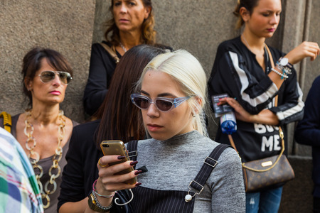 MILAN, ITALY - SEPTEMBER 26: People gather outside Scervino fashion show building for Milan Women's Fashion Week on SEPTEMBER 26, 2015  in Milan.のeditorial素材