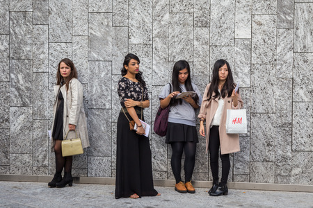 MILAN, ITALY - SEPTEMBER 26: People gather outside Colangelo fashion show building for Milan Women's Fashion Week on SEPTEMBER 26, 2015  in Milan.のeditorial素材