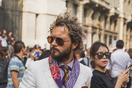 MILAN, ITALY - SEPTEMBER 27: People gather outside Ferragamo fashion show building for Milan Women's Fashion Week on SEPTEMBER 27, 2015  in Milan.のeditorial素材
