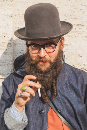MILAN, ITALY - SEPTEMBER 27: People gather outside Ferragamo fashion show building for Milan Women's Fashion Week on SEPTEMBER 27, 2015  in Milan.のeditorial素材