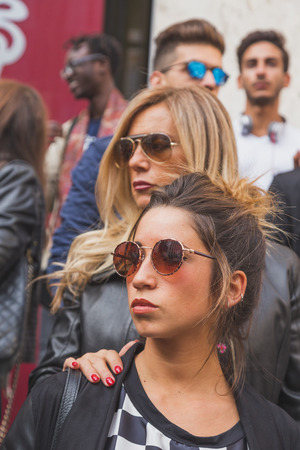 MILAN, ITALY - SEPTEMBER 27: People gather outside Ferragamo fashion show building for Milan Women's Fashion Week on SEPTEMBER 27, 2015  in Milan.のeditorial素材