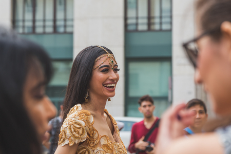MILAN, ITALY - SEPTEMBER 27: People gather outside Ferragamo fashion show building for Milan Women's Fashion Week on SEPTEMBER 27, 2015  in Milan.のeditorial素材