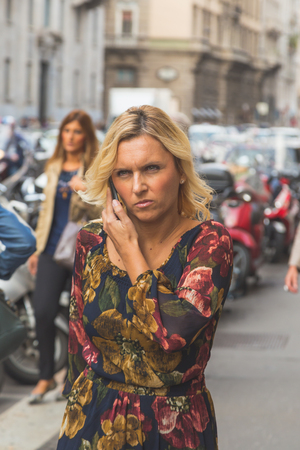 MILAN, ITALY - SEPTEMBER 27: People gather outside Trussardi fashion show building for Milan Women's Fashion Week on SEPTEMBER 27, 2015  in Milan.のeditorial素材