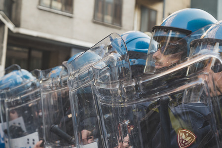 MILAN, ITALY - NOVEMBER 13: Riot police confronting the students during a march in the city streets to protest agaist the public school management on NOVEMBER 13, 2015 in Milan.のeditorial素材