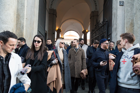 MILAN, ITALY - JANUARY 17: People gather outside Missoni fashion show building for Milan Men's Fashion Week on JANUARY 17, 2016 in Milan.のeditorial素材