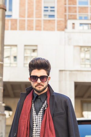 MILAN, ITALY - JANUARY 17: People gather outside Ferragamo fashion show building for Milan Men's Fashion Week on JANUARY 17, 2016 in Milan.のeditorial素材