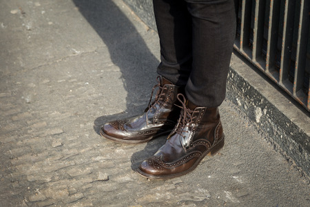 MILAN, ITALY - JANUARY 18: Detail of shoes outside Armani fashion show building for Milan Men's Fashion Week on JANUARY 18, 2016 in Milan.のeditorial素材