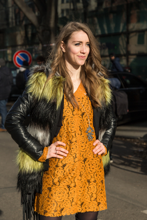 MILAN, ITALY - JANUARY 18: People gather outside Armani fashion show building for Milan Men's Fashion Week on JANUARY 18, 2016 in Milan.のeditorial素材