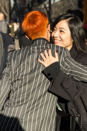 MILAN, ITALY - JANUARY 18: People gather outside Armani fashion show building for Milan Men's Fashion Week on JANUARY 18, 2016 in Milan.のeditorial素材
