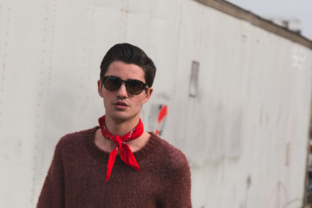 MILAN, ITALY - FEBRUARY 24: People gather outside Gucci fashion show building for Milan Women's Fashion Week on FEBRUARY 24, 2016 in Milan.のeditorial素材