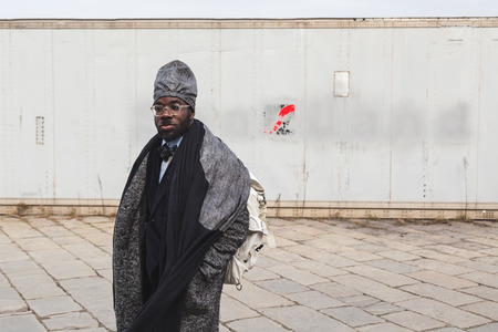 MILAN, ITALY - FEBRUARY 24: People gather outside Gucci fashion show building for Milan Women's Fashion Week on FEBRUARY 24, 2016 in Milan.のeditorial素材