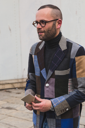 MILAN, ITALY - FEBRUARY 24: People gather outside Gucci fashion show building for Milan Women's Fashion Week on FEBRUARY 24, 2016 in Milan.のeditorial素材