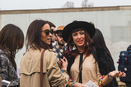 MILAN, ITALY - FEBRUARY 24: People gather outside Gucci fashion show building for Milan Women's Fashion Week on FEBRUARY 24, 2016 in Milan.のeditorial素材