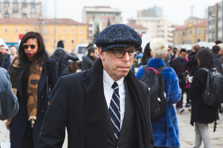MILAN, ITALY - FEBRUARY 24: People gather outside Gucci fashion show building for Milan Women's Fashion Week on FEBRUARY 24, 2016 in Milan.のeditorial素材