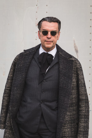 MILAN, ITALY - FEBRUARY 24: People gather outside Gucci fashion show building for Milan Women's Fashion Week on FEBRUARY 24, 2016 in Milan.のeditorial素材