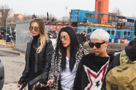 MILAN, ITALY - FEBRUARY 24: People gather outside Gucci fashion show building for Milan Women's Fashion Week on FEBRUARY 24, 2016 in Milan.のeditorial素材