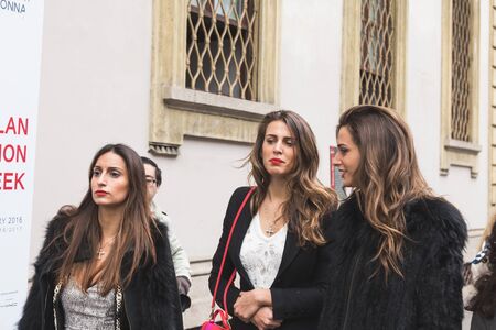 MILAN, ITALY - FEBRUARY 25: People gather outside Luisa Beccaria fashion show building for Milan Women's Fashion Week on FEBRUARY 25, 2016 in Milan.のeditorial素材