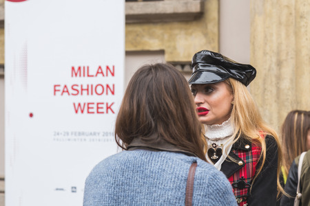 MILAN, ITALY - FEBRUARY 25: People gather outside Luisa Beccaria fashion show building for Milan Women's Fashion Week on FEBRUARY 25, 2016 in Milan.のeditorial素材